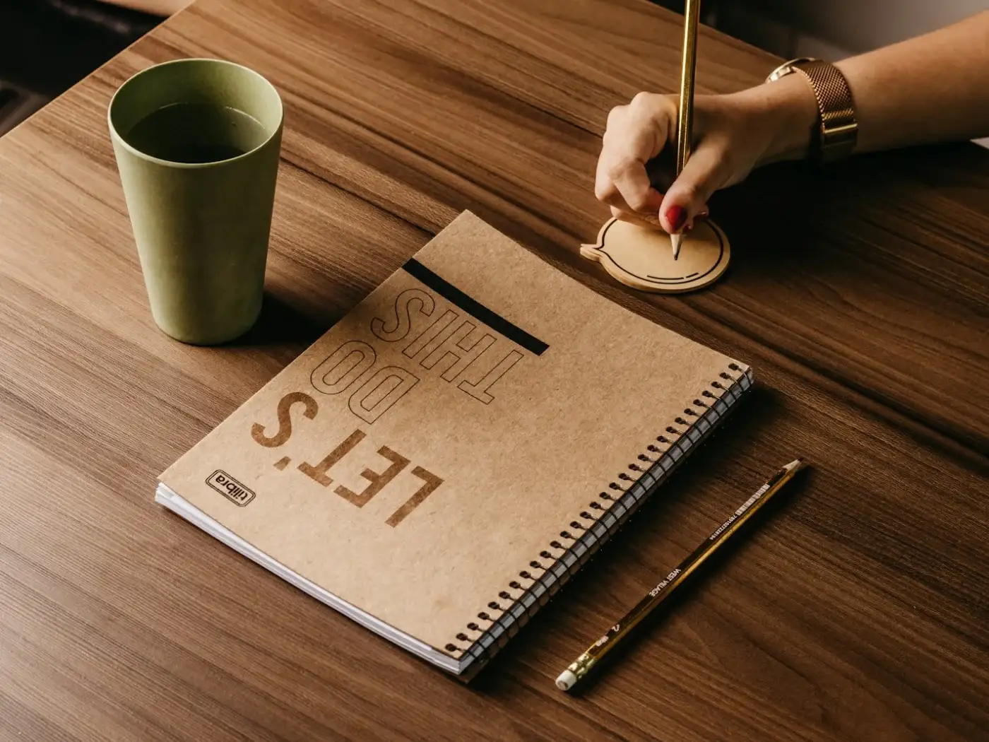 A notebook and coffee on a desk during a planning session